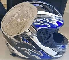 Scrapped and damaged motorcycle helmet